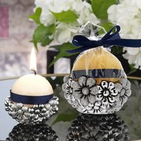 Candela rotonda gialla con margherite 