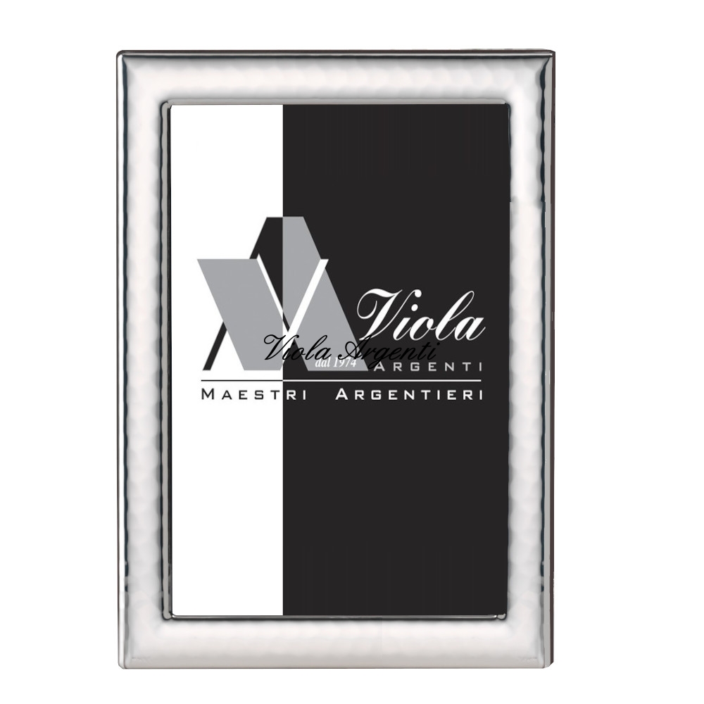 Cornice e specchiera martellata di . Argento online