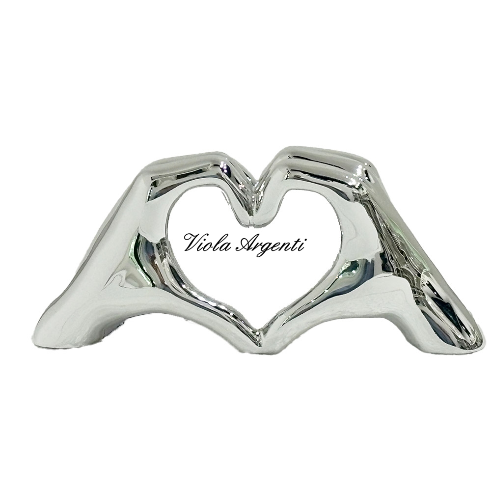 Scultura mani cuore di . Argento online
